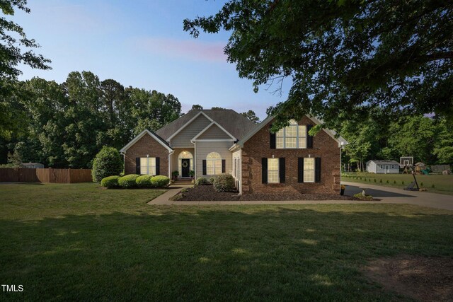 95 Live Oak Dr, Louisburg, NC 27549 - traditional-style house featuring brick siding