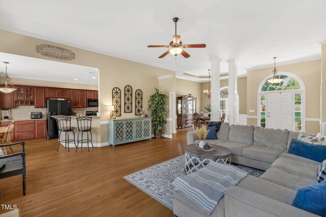 95 Live Oak Dr, Louisburg, NC 27549 - living area with crown molding, light wood-type flooring, a ceiling fan, decorative columns, and recessed lighting