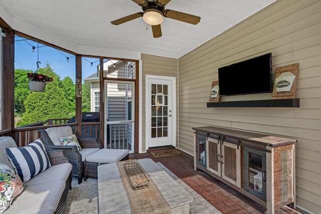 95 Live Oak Dr, Louisburg, NC 27549 - sunroom / solarium featuring outdoor lounge area and ceiling fan
