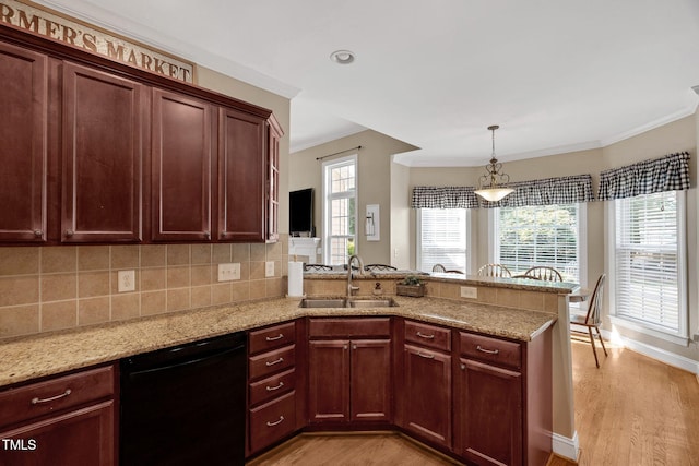 95 Live Oak Dr, Louisburg, NC 27549 - kitchen with a sink, dishwasher, a peninsula, light wood-style flooring, and ornamental molding