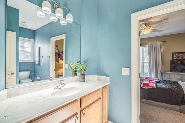 95 Live Oak Dr, Louisburg, NC 27549 - bathroom featuring healthy amount of natural light, toilet, a ceiling fan, and vanity