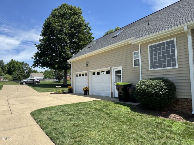 95 Live Oak Dr, Louisburg, NC 27549 - garage with concrete driveway