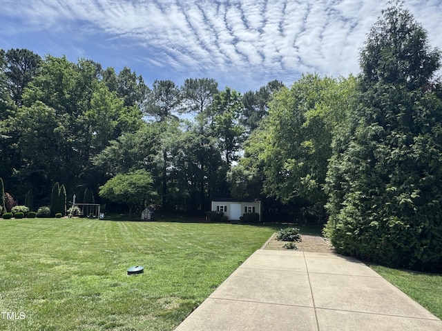 95 Live Oak Dr, Louisburg, NC 27549 - view of green lawn featuring an outbuilding