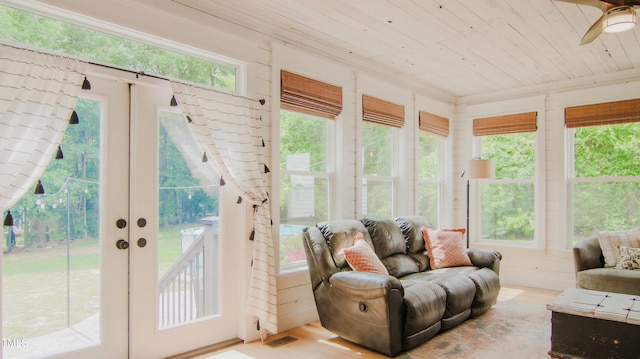 sunroom / solarium with a healthy amount of sunlight, wood ceiling, french doors, and visible vents