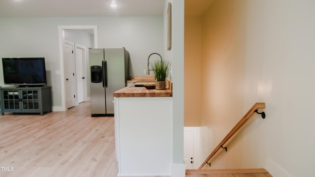 interior space with baseboards and wood finished floors