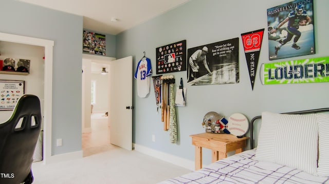 bedroom with baseboards and carpet flooring