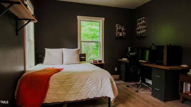 bedroom featuring wood finished floors