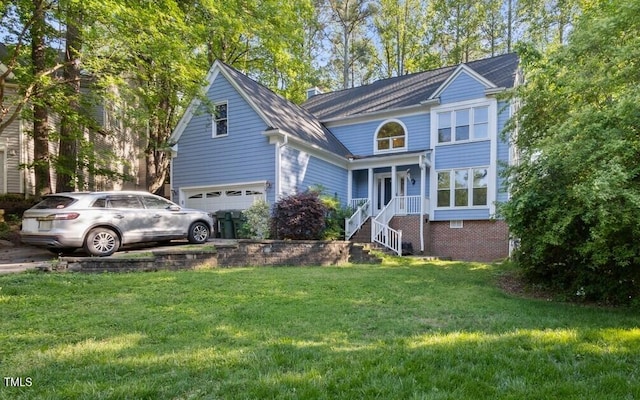 traditional-style house featuring a garage and a front lawn