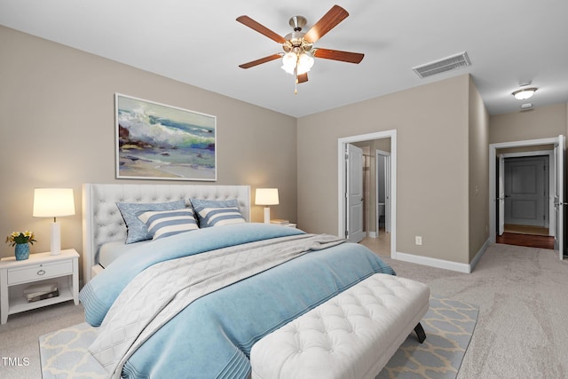 bedroom with baseboards, a ceiling fan, light colored carpet, and visible vents