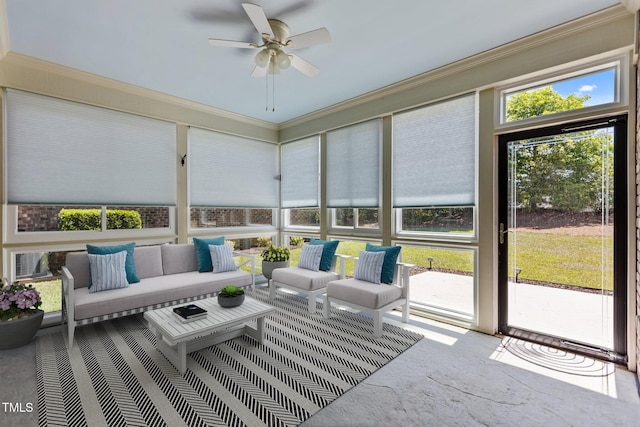 sunroom with ceiling fan and an outdoor hangout area