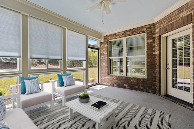 sunroom featuring ceiling fan