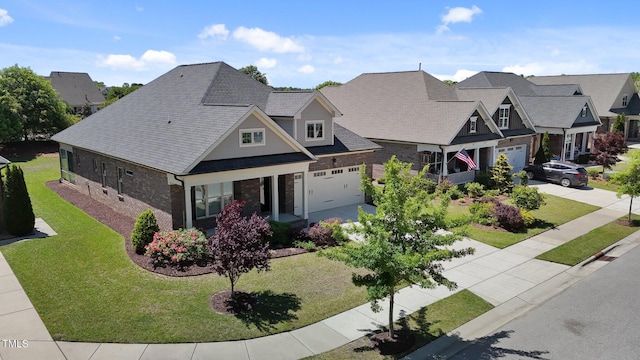 view of front facade with a residential view, concrete driveway, a front lawn, and stone siding