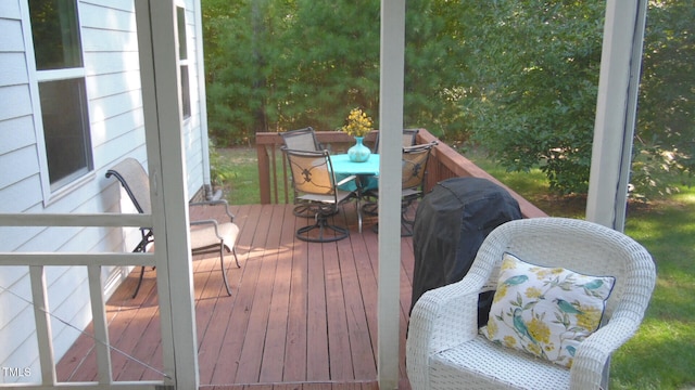 wooden terrace featuring outdoor dining area