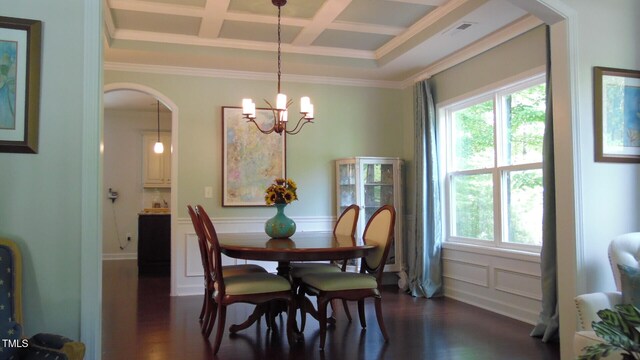 106 N Duelling Oaks Dr, Chapel Hill, NC 27517 - dining room featuring arched walkways, coffered ceiling, dark wood-style flooring, ornamental molding, and a chandelier