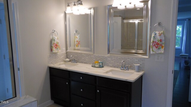 106 N Duelling Oaks Dr, Chapel Hill, NC 27517 - bathroom featuring tasteful backsplash and double vanity