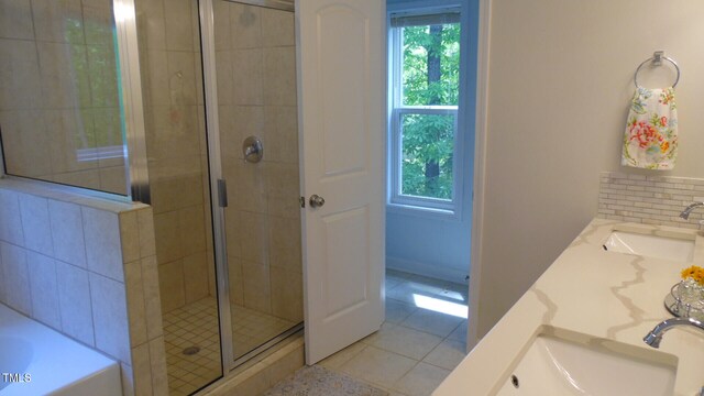 106 N Duelling Oaks Dr, Chapel Hill, NC 27517 - bathroom featuring healthy amount of natural light, a stall shower, tile patterned flooring, and a garden tub