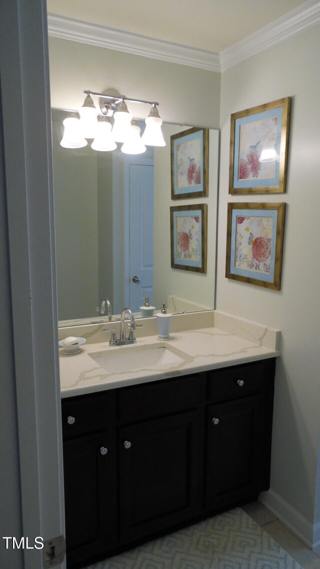 106 N Duelling Oaks Dr, Chapel Hill, NC 27517 - bathroom featuring crown molding, vanity, tile patterned floors, a chandelier, and baseboards