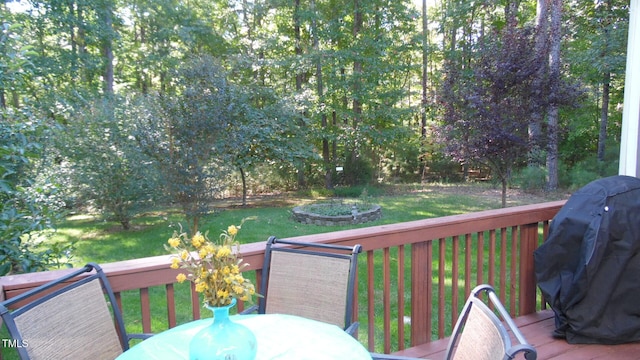 106 N Duelling Oaks Dr, Chapel Hill, NC 27517 - wooden deck featuring outdoor dining space, a lawn, and a grill