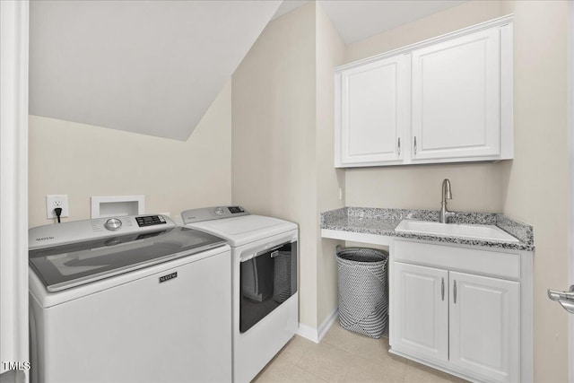 1533 Santa Lucia St, Wake Forest, NC 27587 - laundry room featuring independent washer and dryer, cabinet space, light tile patterned floors, and baseboards