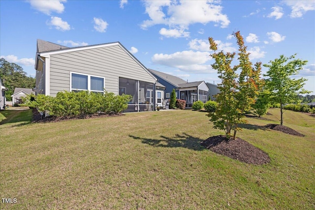 1533 Santa Lucia St, Wake Forest, NC 27587 - rear view of house with a sunroom and a lawn
