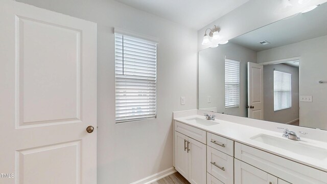 1314 Rosepine Dr, Cary, NC 27519 - bathroom with double vanity and baseboards