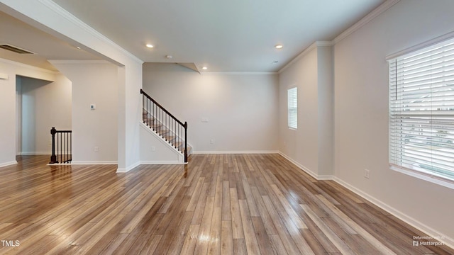 1314 Rosepine Dr, Cary, NC 27519 - unfurnished living room featuring wood finished floors, stairway, recessed lighting, ornamental molding, and baseboards