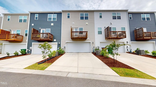 1314 Rosepine Dr, Cary, NC 27519 - rear view of house featuring cooling unit, concrete driveway, and a garage