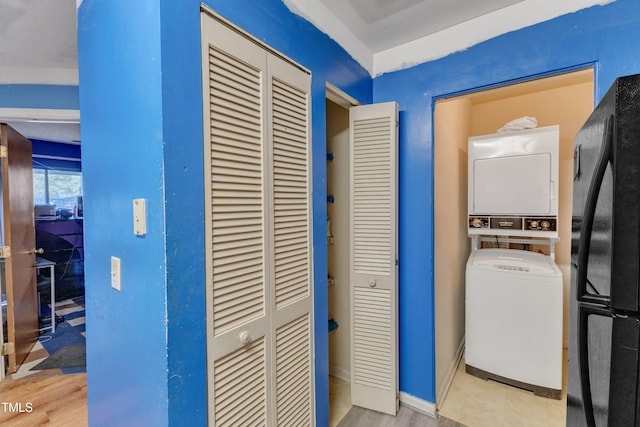 laundry area with stacked washing maching and dryer and laundry area