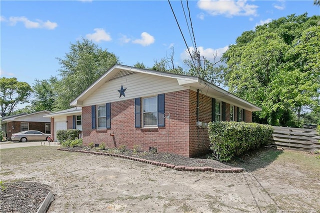 1810 Ashton Rd, Fayetteville, NC 28304 - view of front facade featuring brick siding, an attached garage, fence, and driveway