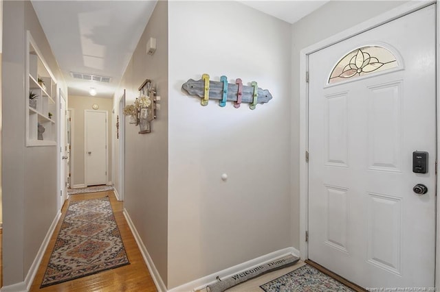 1810 Ashton Rd, Fayetteville, NC 28304 - foyer featuring light wood-style floors, baseboards, and visible vents