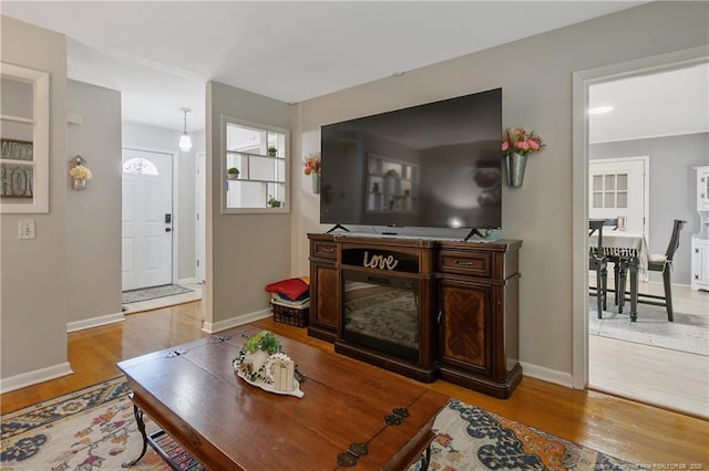1810 Ashton Rd, Fayetteville, NC 28304 - living room featuring baseboards and wood finished floors