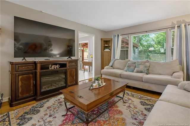 1810 Ashton Rd, Fayetteville, NC 28304 - living room featuring baseboards and light wood-type flooring