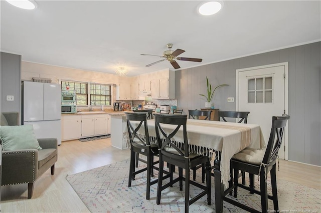 1810 Ashton Rd, Fayetteville, NC 28304 - dining area with ceiling fan, ornamental molding, and light wood-type flooring