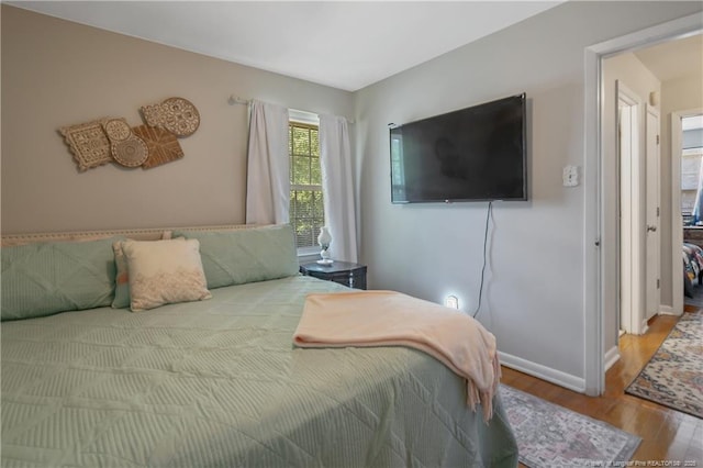 1810 Ashton Rd, Fayetteville, NC 28304 - bedroom featuring baseboards and wood finished floors