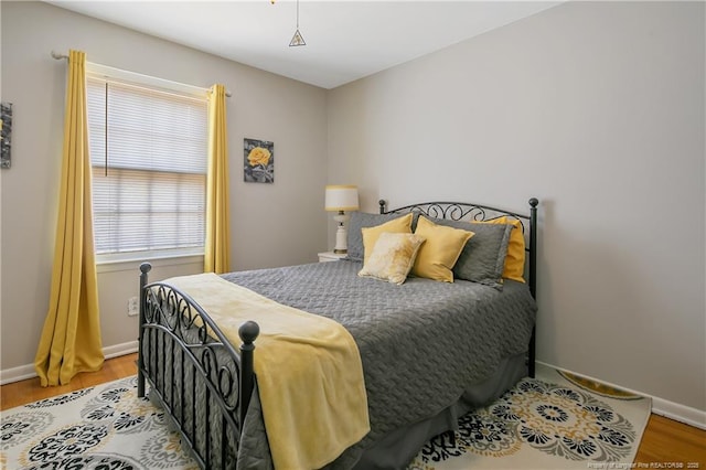 1810 Ashton Rd, Fayetteville, NC 28304 - bedroom with baseboards and wood finished floors
