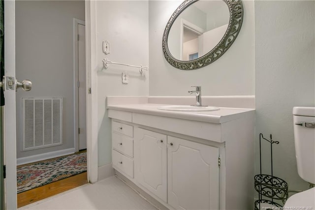 1810 Ashton Rd, Fayetteville, NC 28304 - bathroom featuring vanity, wood finished floors, and visible vents