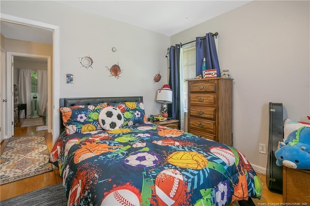 1810 Ashton Rd, Fayetteville, NC 28304 - bedroom featuring baseboards and wood finished floors