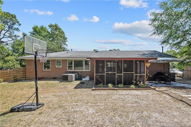 1810 Ashton Rd, Fayetteville, NC 28304 - rear view of property with central AC unit, a sunroom, brick siding, fence, and a patio