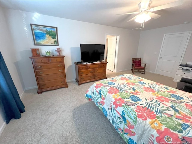 bedroom with baseboards, a ceiling fan, and light colored carpet