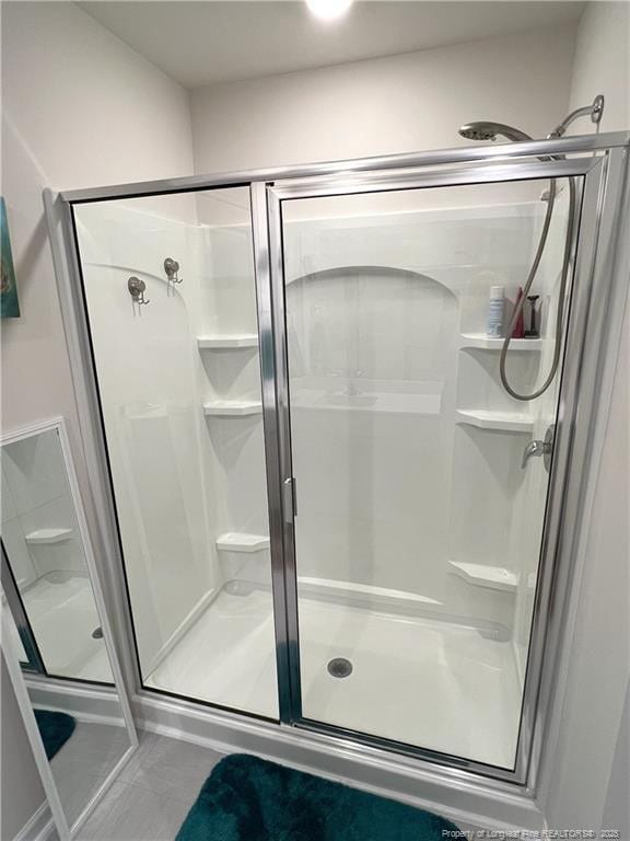 bathroom featuring a stall shower