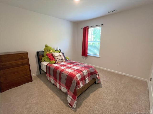 bedroom featuring carpet floors, baseboards, and visible vents