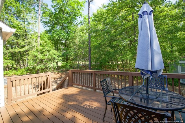 wooden deck featuring outdoor dining space