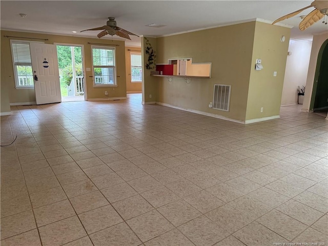 921 Pickard Rd, Sanford, NC 27330 - unfurnished living room with a ceiling fan, baseboards, ornamental molding, light tile patterned floors, and arched walkways