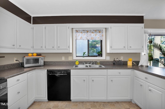 kitchen featuring a sink, plenty of natural light, black dishwasher, and white cabinetry
