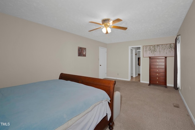 bedroom with baseboards, a ceiling fan, carpet, and visible vents