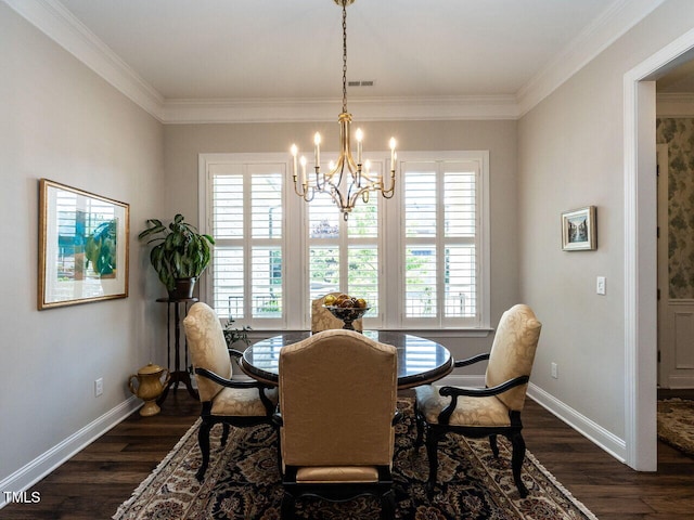 dining room with plenty of natural light, dark wood-style flooring, a chandelier, and ornamental molding