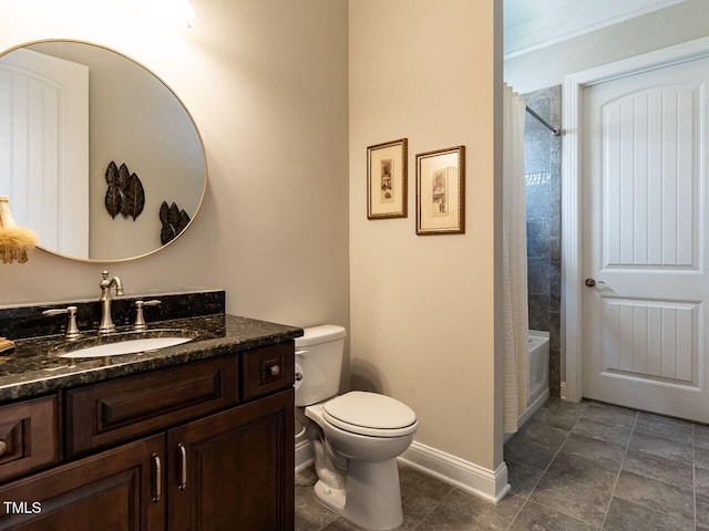 bathroom featuring toilet, baseboards, vanity, and washtub / shower combination