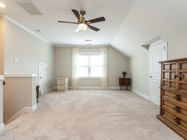 additional living space featuring light carpet, ceiling fan, baseboards, and vaulted ceiling
