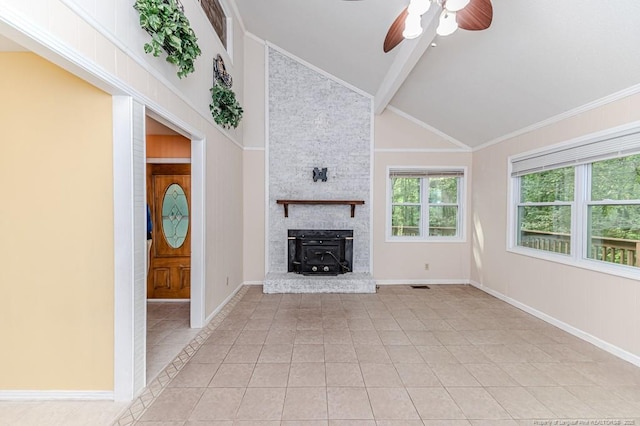 unfurnished living room with ceiling fan, a wood stove, high vaulted ceiling, baseboards, and light tile patterned floors