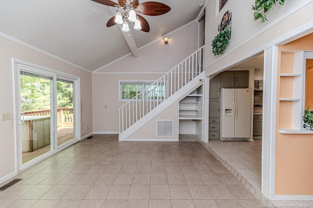 interior space featuring light tile patterned flooring, ceiling fan, visible vents, and stairway